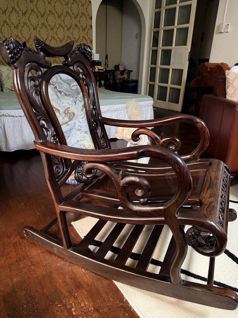 Rocking chair (Category: Chairs) located in Quezon City. Submitted by redcherry131 (Listing ID 1460866081, Image 1). Description: Vietnam Rosewood with marble back. Intricate rose flower design. Custom made. Very thick solid wood. Very beautiful in person. .