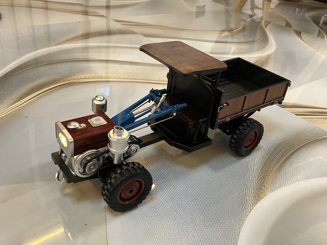 Roto Tiller or “Kuliglig” (Category: Remote Control Toys) located in Dagupan City. Submitted by raspberry27 (Listing ID 1460881342, Image 2). Description: Here’s an rc roto tiller toy that comes with a box, controller, and a rechargeable battery. It has a tank that you fill water with a dropper then it produces a real steam and an authentic sound after you turn the crank. It has a dump bed that has sides which you can pull down. Also it’s a four 