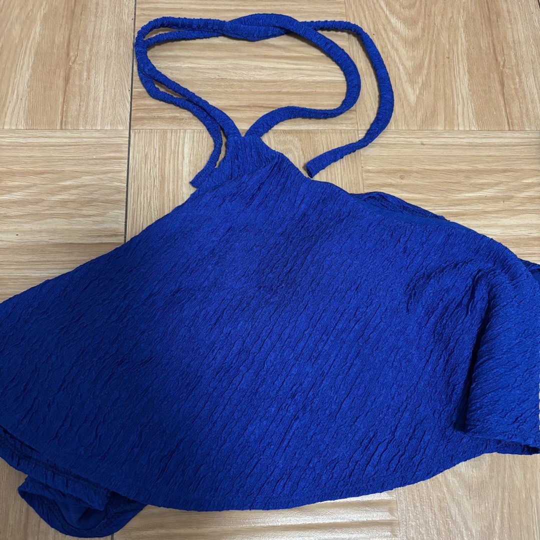 Royal Blue Textured Halter Neck Crop Top (Category: Sleeveless) located in Rizal. Submitted by jmcraftingphhandicrafts (Listing ID 1460856616, Image 2). Description: Super cute royal blue halter top. Textured fabric gives it a nice feel. Ties at the back for an adjustable fit. Great for going out or a casual day. Pairs well with jeans or shorts. Really comfy and stylish. Rfs: New; Di pa ginagamit.