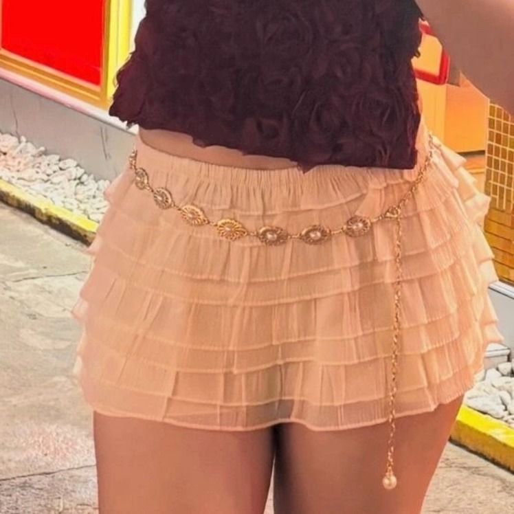 Ruffled Tiered Mini Skort XL (Category: Skirts) located in Lucena. Submitted by the.hidden.closet (Listing ID 1460894446, Image 2). Description: DECLUTTERING SALE ✨ Super cute ruffled mini skort beige size XL. Features multiple tiers for a flowy look. Elastic waistband for comfort. Great for dressing up or down. Perfect for summer days or nights out. 📏 Size: XL Color: Beige Length: 12" | Waistband: 16" laid flat.