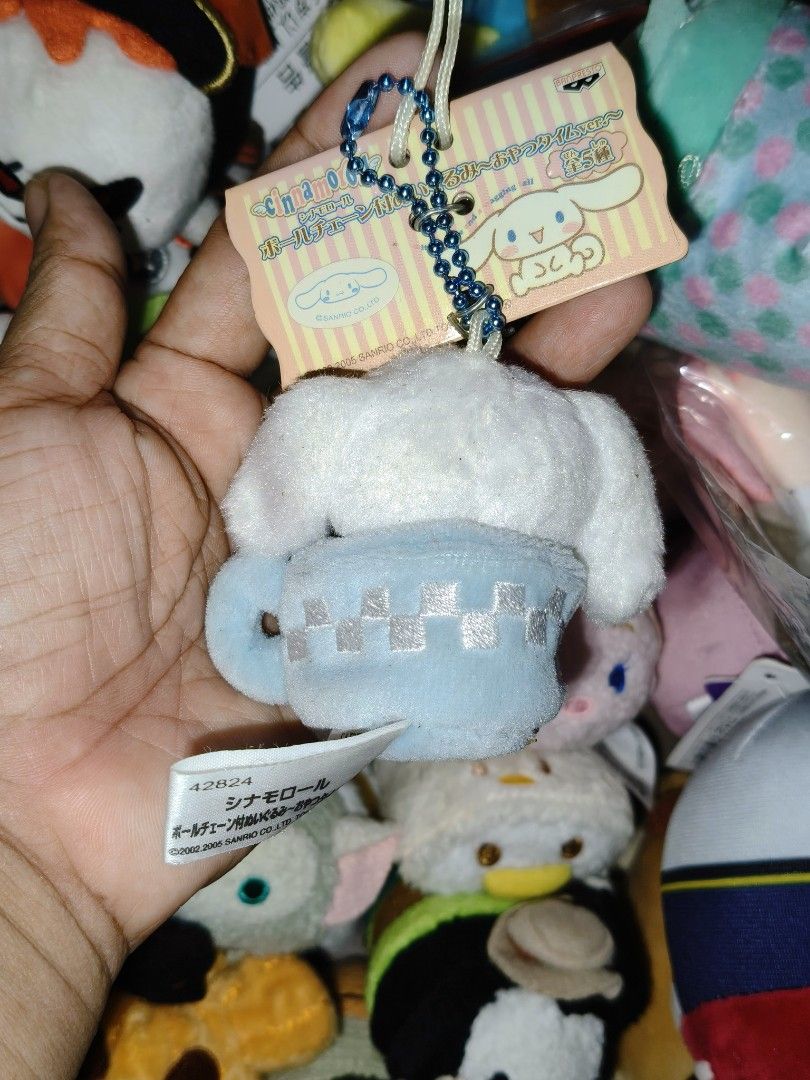 Sanrio Cinnamoroll Plush Keychain in Cup (Category: Plushies & Soft Toys) located in Manila. Submitted by neroneko-pb126 (Listing ID 1460823067, Image 2). Description: - Adorable Cinnamoroll plush keychain. - Features Cinnamoroll sitting in a cute blue checkered cup. - Includes a beaded chain for easy attachment. - Comes with the original tag. - Ideal for decorating bags, backpacks, or keys. - Authentic Sanrio product, made by Banpresto..