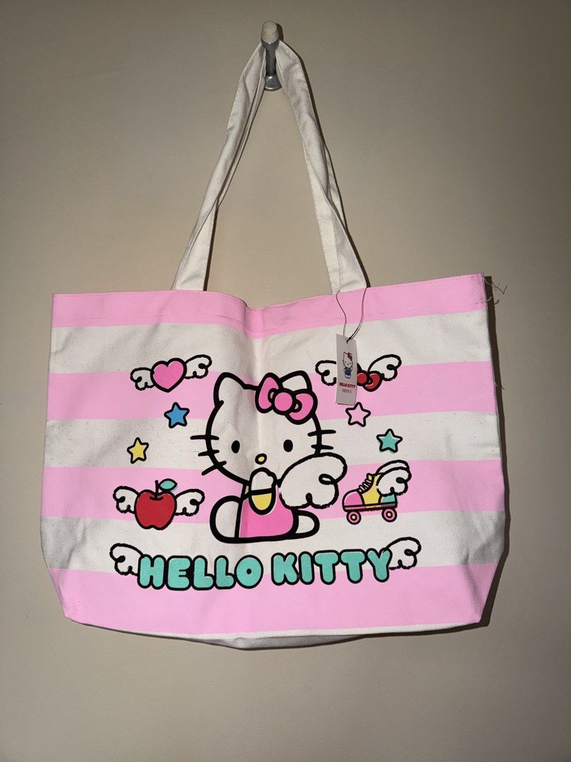 Sanrio Hello Kitty Pink Canvas Tote Bag (Category: Tote Bags) located in Binan City. Submitted by jaewinhaul (Listing ID 1460793834, Image 1). Description: - Has minimal unnoticeable dot stains but never been used. Can be cleaned. Still with tag on. - Location: Biñan City, Laguna - Payment: Gcash.