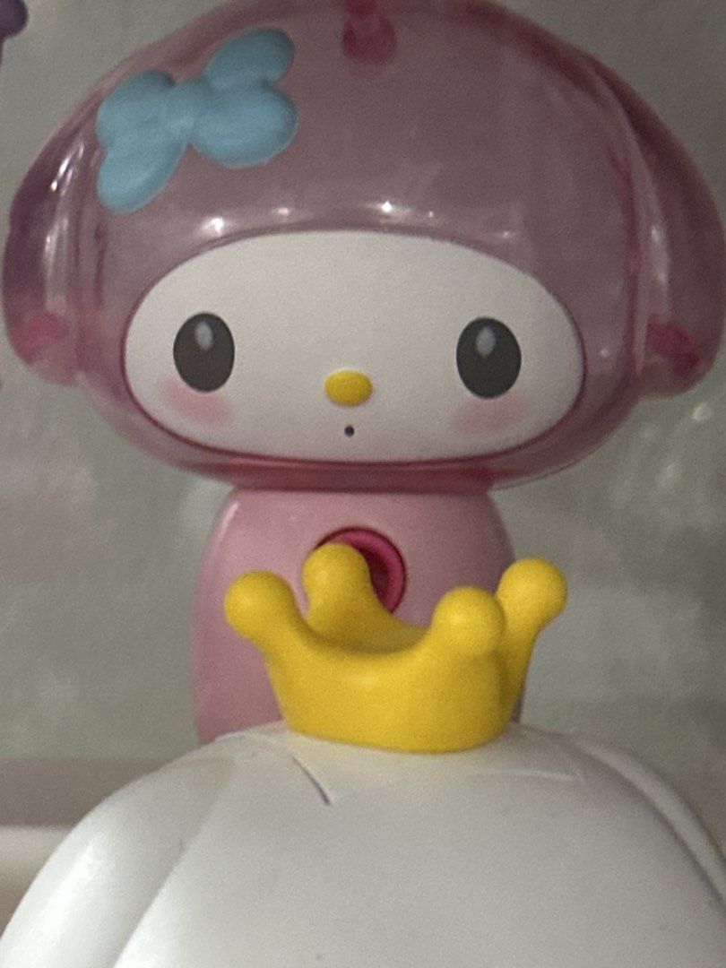 Sanrio My Melody Figure (Category: Figurines & Statues) located in Manila. Submitted by lunalux09 (Listing ID 1460804803, Image 1). Description: - Adorable My Melody figure - Features charming pink and purple colors - Topped with a cute little yellow crown - Perfect for Sanrio collectors and fans - Makes a wonderful display piece for desks or shelves.