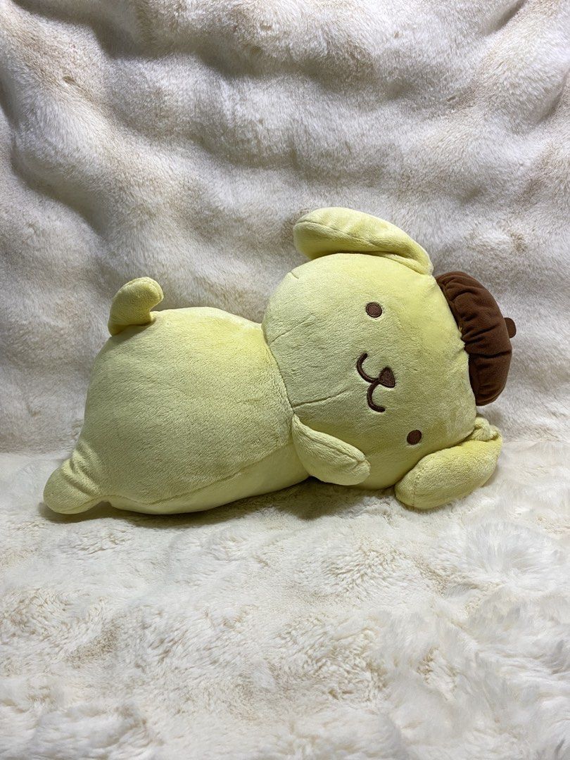 Sanrio Pompompurin Plush Toy (Category: Plushies & Soft Toys) located in Kalibo. Submitted by ollie_stuffshop (Listing ID 1460912720, Image 1). Description: 26cm x 22cm x 37cm Before you send your inquiries: ❗️Last Price is already posted ❗️Manage your expectations, WYSIWYG ❗️May need washing ❗️Dropoff is every Wednesday & Sunday - Adorable Pompompurin plush toy - Features the classic yellow dog with a brown beret - Relaxed lying down pose - Incr