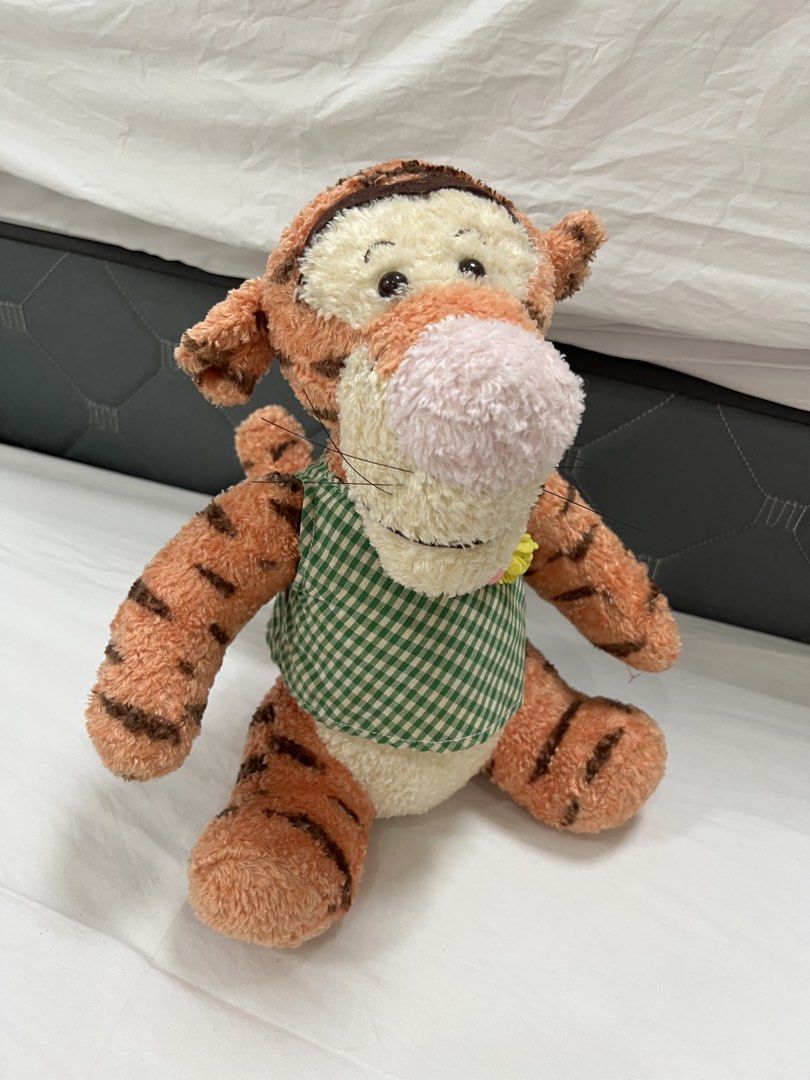 SEGA Disney Tigger Plush Toy (Category: Plushies & Soft Toys) located in Muntinlupa City. Submitted by goldinmygarage (Listing ID 1460879614, Image 1). Description: - SEGA Tigger Plush Toy - No stains and smell -Very Classic Looking - Features a charming green checkered vest - Ideal for collectors and Winnie the Pooh enthusiasts.