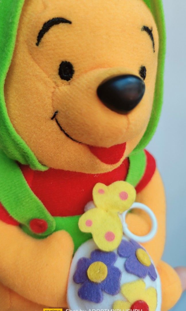 SEGA Disney Winnie-the-Pooh plush (interactive) (Category: Plushies & Soft Toys) located in Taguig. Submitted by adopt.my.plush.ph (Listing ID 1460726643, Image 2). Description: Disney Winnie-the-Pooh plush toy dressed in a green and yellow bee or flower costume holding a small felt flower basket *pull the cord (yellow bee) out to make the wings flap rapidly as the cord retracts.