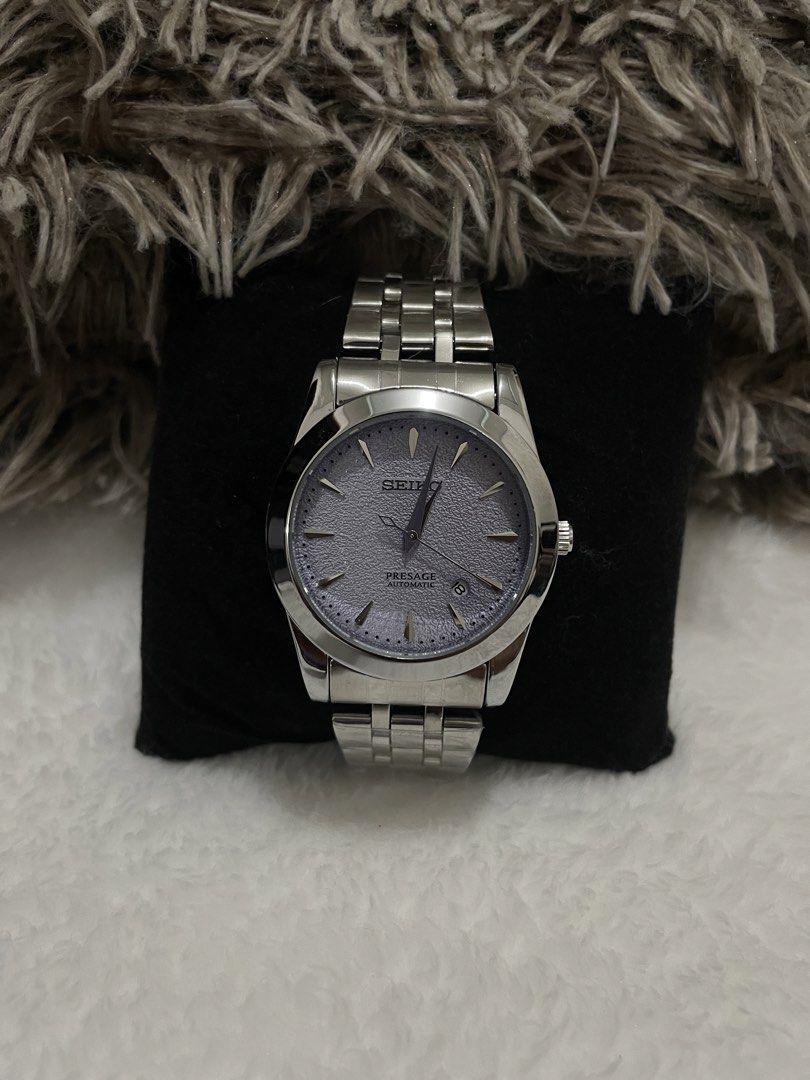 Seiko Presage Automatic Men's Watch (Category: Men's Watches) located in Manila. Submitted by streets.ph (Listing ID 1460811125, Image 1). Description: - Seiko Presage Automatic Watch - Elegant Grey Textured Dial - Silver Hands and Hour Markers - Convenient Date Window at 3 o'clock - Durable Stainless Steel Bracelet - Versatile: Ideal for both daily wear and formal occasions.