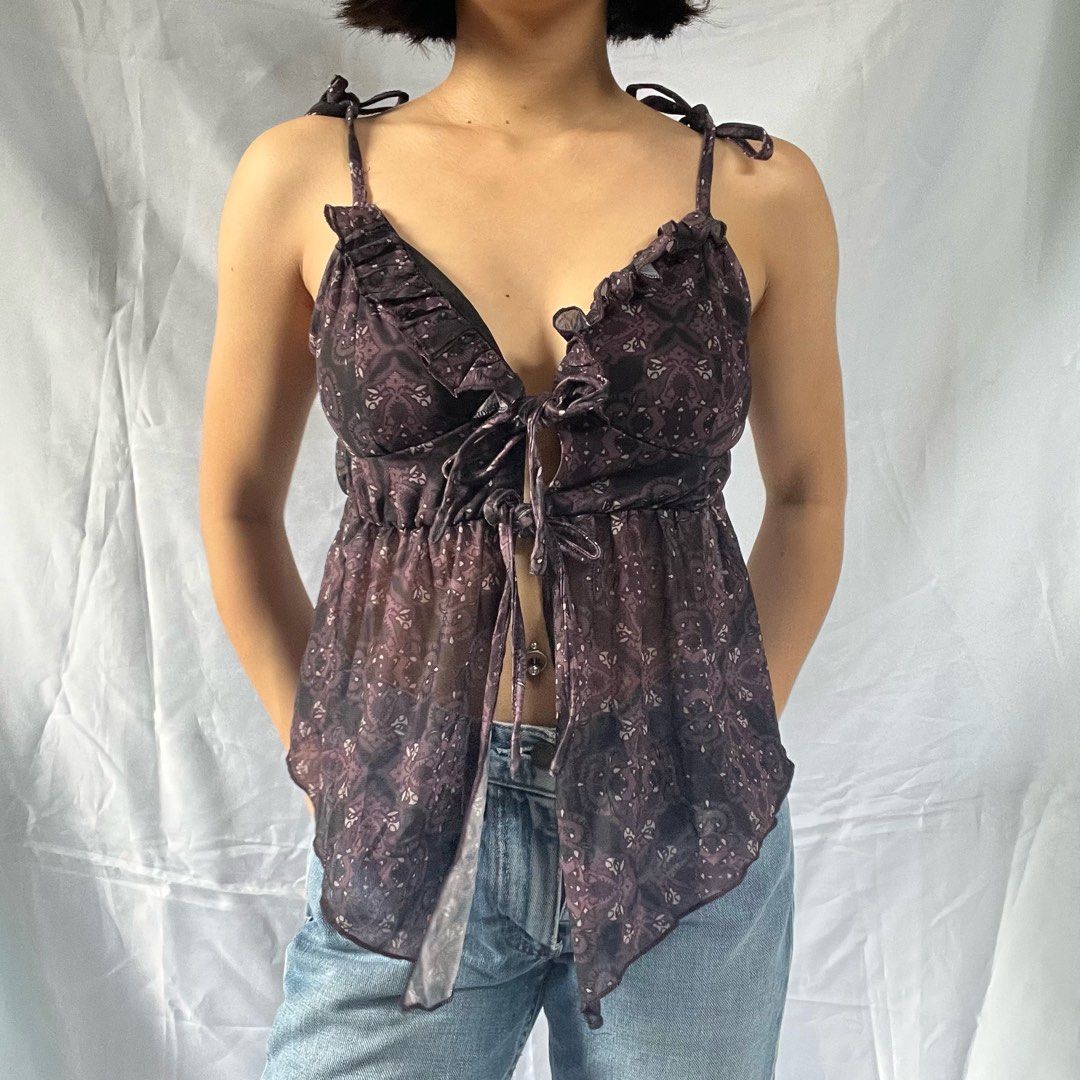 Sheer Paisley Tie-Front Ruffle Cami Top (Category: Sleeveless) located in Manila. Submitted by demi.rewears (Listing ID 1460863189, Image 3). Description: Sheer purple paisley cami top with tie-front and ruffled trim. Adjustable straps. Lightweight and flowy. Size: Fits Small to Semi-Medium Bust: Fits 28” to 32” (15” flat lay) Length: 11.5” (Cropped length).