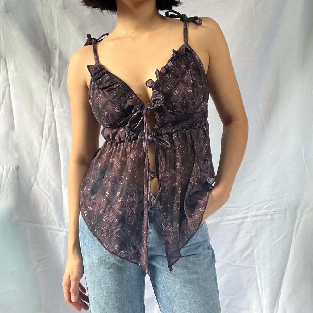 Sheer Paisley Tie-Front Ruffle Cami Top (Category: Sleeveless) located in Manila. Submitted by demi.rewears (Listing ID 1460863189, Image 2). Description: Sheer purple paisley cami top with tie-front and ruffled trim. Adjustable straps. Lightweight and flowy. Size: Fits Small to Semi-Medium Bust: Fits 28” to 32” (15” flat lay) Length: 11.5” (Cropped length).