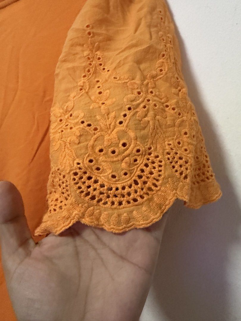 SHEIN Orange Eyelet Top (Category: Blouses) located in Paranaque City. Submitted by zen.dycluttering (Listing ID 1460863038, Image 3). Description: - SHEIN Curve Orange T-shirt - Size: 2XL on tag but can fit XL - Cute eyelet details on sleeves.