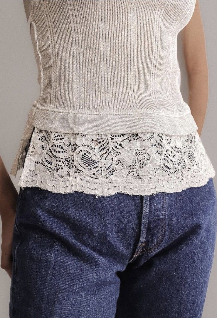 Shimmer lace trim knit (Category: Blouses) located in Las Pinas. Submitted by boardroomcloset (Listing ID 1460915813, Image 3). Description: STELLA SOLE Shimmer Lace-Trim Knit Camisole Top – Silver Gray Price:900 Size: Small Made in: Italy Fabric: 80% Polyester 20% Viscose Color: Shimmer silver-gray with ivory lace and satin ribbon Details: • Fine ribbed stretch knit • Subtle shimmer finish • Square neckline • Slim shoulder straps • Fitted camiso