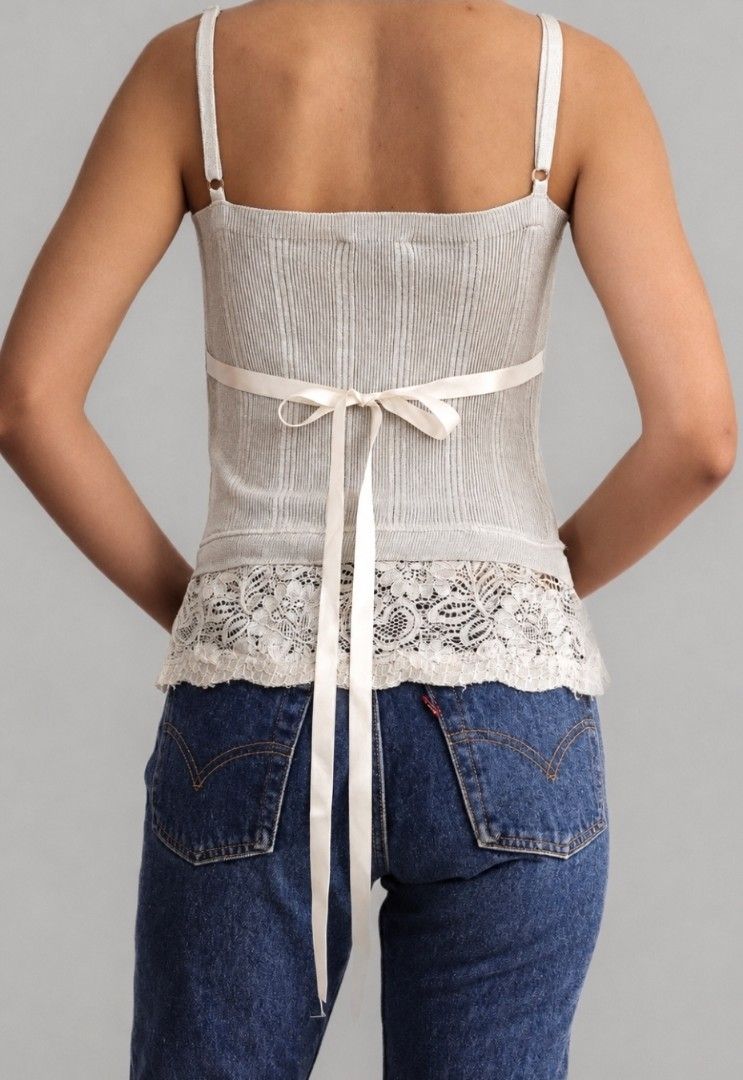 Shimmer lace trim knit (Category: Blouses) located in Las Pinas. Submitted by boardroomcloset (Listing ID 1460915813, Image 2). Description: STELLA SOLE Shimmer Lace-Trim Knit Camisole Top – Silver Gray Price:900 Size: Small Made in: Italy Fabric: 80% Polyester 20% Viscose Color: Shimmer silver-gray with ivory lace and satin ribbon Details: • Fine ribbed stretch knit • Subtle shimmer finish • Square neckline • Slim shoulder straps • Fitted camiso
