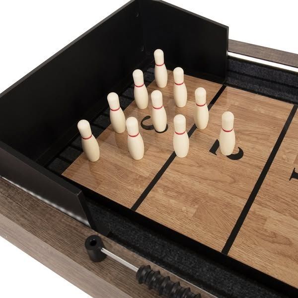 SHUFFLEBOARD TABLE (Category: Billiards and Bowling) located in San Pablo. Submitted by ablpsports (Listing ID 1460745529, Image 2). Description: - 2-in-1 Wooden Shuffleboard & Bowling Table - Includes 10 wooden pins, 4 pucks, and a brush - Smooth wooden playing surface - Sturdy wooden frame with black metal legs - Approximately 7-8 feet long - Ideal for family fun and game nights - Ready for pickup.