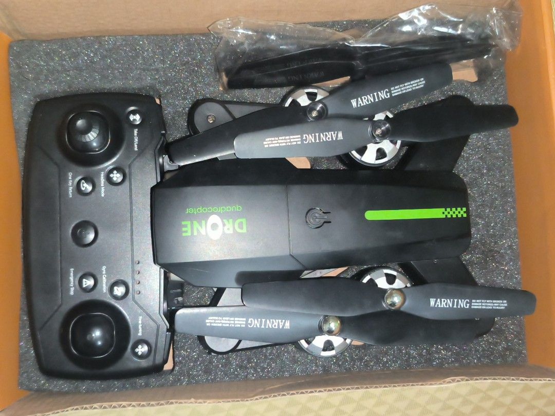 Sky Patrol Foldable Drone with Camera (Category: Drones) located in Quezon City. Submitted by jhiim (Listing ID 1460725139, Image 3). Description: As is where is, Buy your own risk. Declared as untested. -Walang batt yung drone kaya di ma test kung working - Yung controller putol yung isang joystick but tested working, nag papower on. .