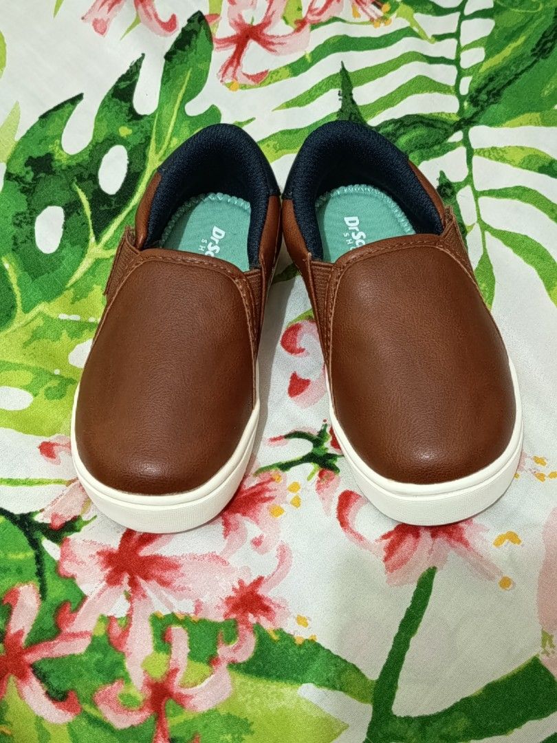 Slip-On Shoes for boy toddlers (Category: Babies & Kids Fashion) located in Manila. Submitted by jhay27decluttering (Listing ID 1460809345, Image 1). Description: PLEASE READ THE DESCRIPTIONS 🙋🙋 - Brand: Dr. Scholl's - Color: Brown - Style: Slip-on - Size: 7M Toddler (US) (12cm) see 2nd photo - Features: Easy for kids to wear, honeycomb pattern soles for grip - Condition: The shoes are NEW! Bought in the US but never used. Hence, no box to fit 