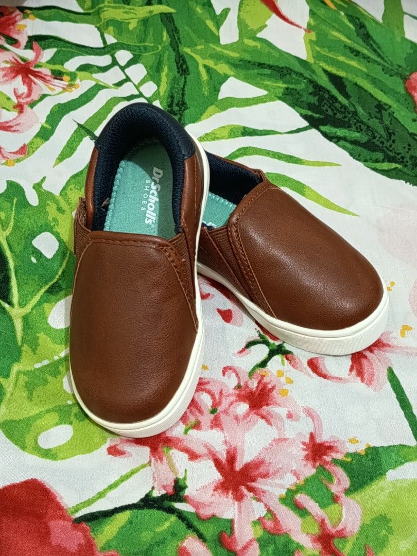 Slip-On Shoes for boy toddlers (Category: Babies & Kids Fashion) located in Manila. Submitted by jhay27decluttering (Listing ID 1460809345, Image 3). Description: PLEASE READ THE DESCRIPTIONS 🙋🙋 - Brand: Dr. Scholl's - Color: Brown - Style: Slip-on - Size: 7M Toddler (US) (12cm) see 2nd photo - Features: Easy for kids to wear, honeycomb pattern soles for grip - Condition: The shoes are NEW! Bought in the US but never used. Hence, no box to fit 