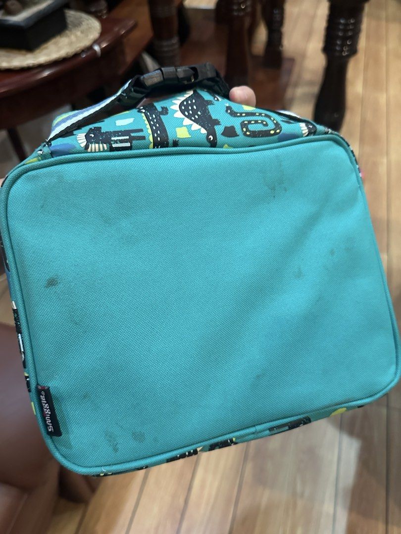 Smiggle Dinosaur Lunch Bag Teal (Category: Babies & Kids Fashion) located in Quezon City. Submitted by mthereser43807 (Listing ID 1460758628, Image 3). Description: - Fun Smiggle dinosaur lunch bag - Teal color with black & green accents - Insulated interior to keep food fresh - Includes an internal name tag - Ideal for school or day trips.