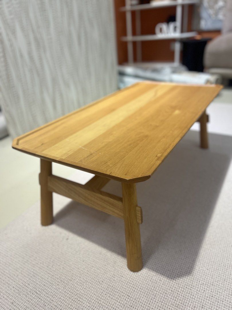 Solid Wood Coffee Table (Category: Tables & Sets) located in Singapore. Submitted by Weliving2002 (Listing ID 1460822876, Image 2). Description: 90x45x H32cm - Natural wood finish - Sturdy four-leg design - Subtle bevelled edge tabletop - Versatile: coffee table or low side table - Perfect for modern and minimalist interiors.
