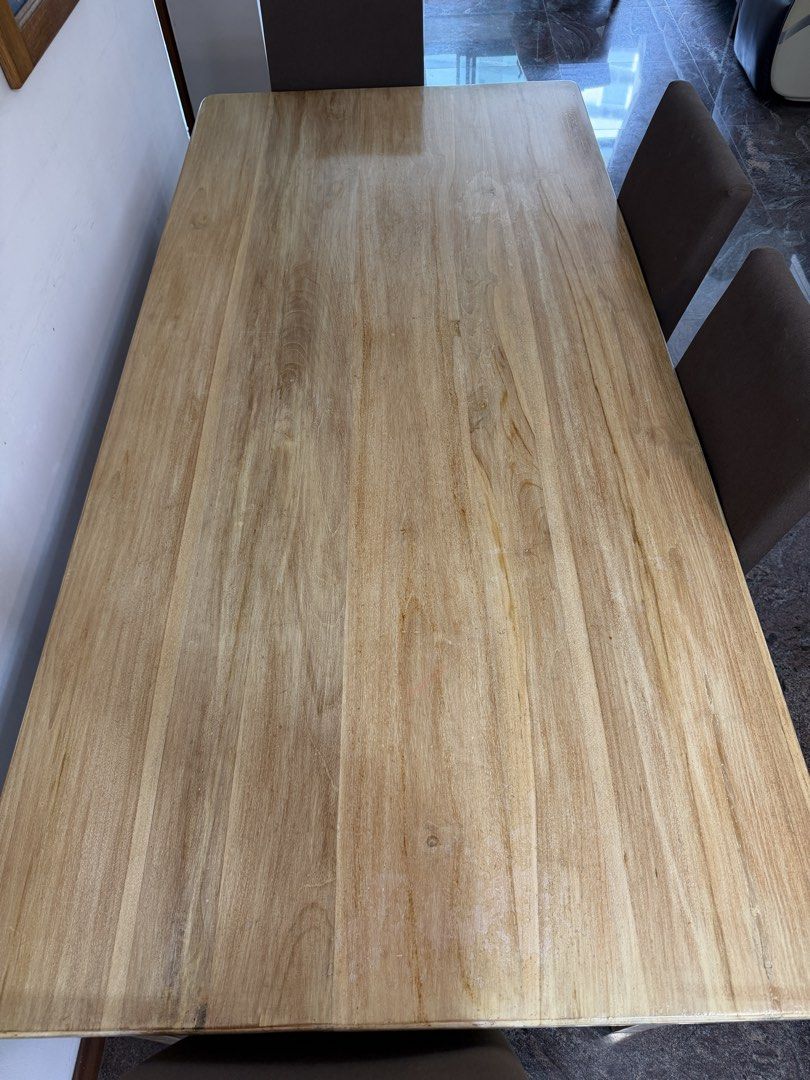 Solid wooden table (Category: Tables & Sets) located in Singapore. Submitted by junwei12321 (Listing ID 1460746367, Image 3). Description: Solid wooden dining table. Comes with 6 chair free. Length 180cm Breadth 84cm Height 76cm.