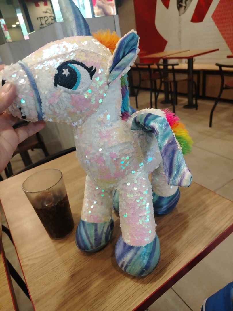 Sparkly Sequin Unicorn Plush Toy with Rainbow Mane (Category: Plushies & Soft Toys) located in Manila. Submitted by purediamond888 (Listing ID 1460796455, Image 3). Description: - Super cute sparkly unicorn plushie - Covered in iridescent sequins - Rainbow colored mane and tail - Blue and purple tie-dye wings - Ideal for kids or as a fun decoration.