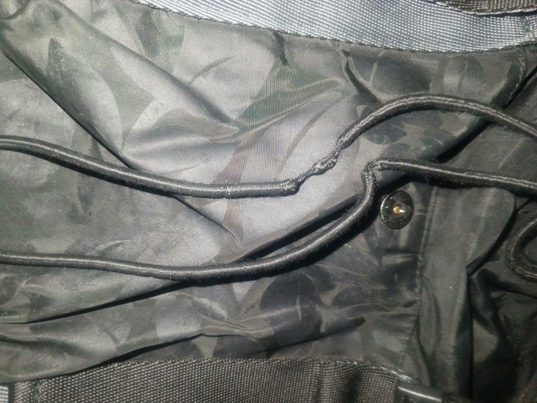 Stella McCartney x Adidas Black Backpack (Category: Backpacks) located in Manila. Submitted by closetqueen_2 (Listing ID 1460906657, Image 3). Description: - Authentic Stella McCartney x Adidas backpack. Good pre-owned condition. - Features a subtle all-over floral pattern. - Main compartment with secure drawstring closure. Flaw: overstretched drawstring due to wear. - Adjustable straps with buckle closures for a customized fit. Scratches on plas
