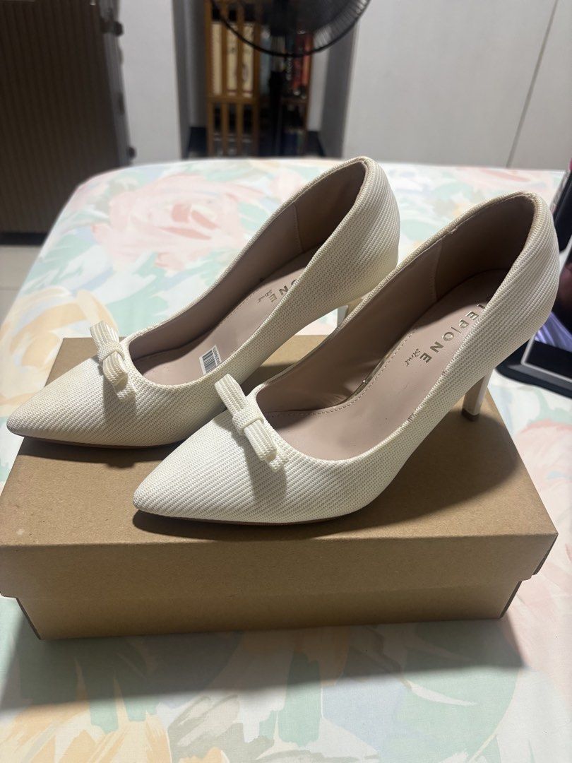 STEP ONE White Textured Bow Stiletto Heels (Category: Heels) located in Quezon City. Submitted by ricalazo (Listing ID 1460894012, Image 1). Description: - Brand: STEP ONE - Style: White textured stiletto heels - Features: Cute bow detail at the front, pointed toe design - Size: 37 - Condition: Minor marks on heels (please check photos for details) Bought early this year. Worn only once. Stored after and found it slightly soiled possibly some mou