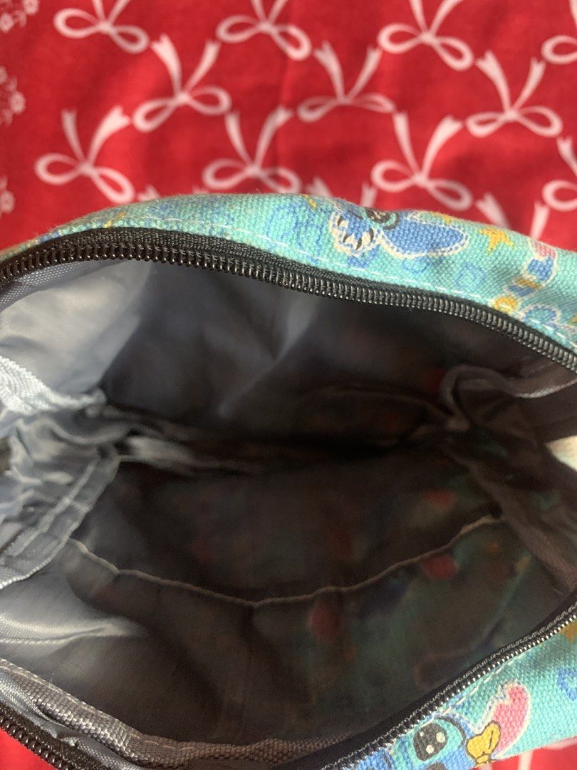 Stitch sling bag and wallet duo (Category: Sling Bags) located in Navotas City. Submitted by elaitems (Listing ID 1460790966, Image 3). Description: - Stitch sling bag and wallet duo - Recommend for stitch lovers - Very spacious and lightweight - No issues, No stain, Brand new! - Negotiable price ‼️.