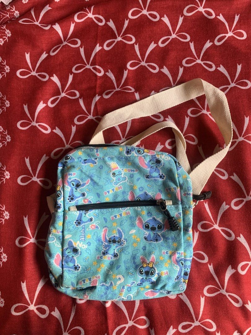 Stitch sling bag and wallet duo (Category: Sling Bags) located in Navotas City. Submitted by elaitems (Listing ID 1460790966, Image 2). Description: - Stitch sling bag and wallet duo - Recommend for stitch lovers - Very spacious and lightweight - No issues, No stain, Brand new! - Negotiable price ‼️.