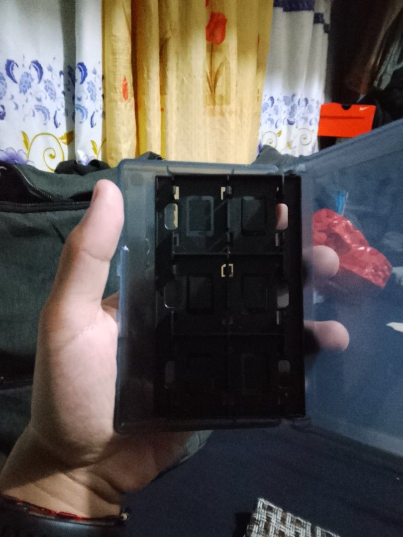 Storage for nintendo Switch cartilage (Category: Cases & Covers) located in Manila. Submitted by freeowl-478c (Listing ID 1460839649, Image 2). Description: - Nintendo Switch game cartridge storage case - Compact and portable design - Securely holds multiple game cartridges - Protects your games from dust and damage - Ideal for organizing your game collection.