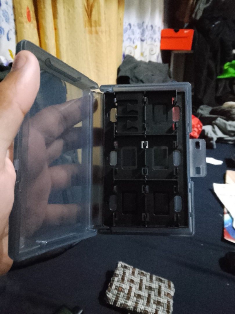 Storage for nintendo Switch cartilage (Category: Cases & Covers) located in Manila. Submitted by freeowl-478c (Listing ID 1460839649, Image 1). Description: - Nintendo Switch game cartridge storage case - Compact and portable design - Securely holds multiple game cartridges - Protects your games from dust and damage - Ideal for organizing your game collection.