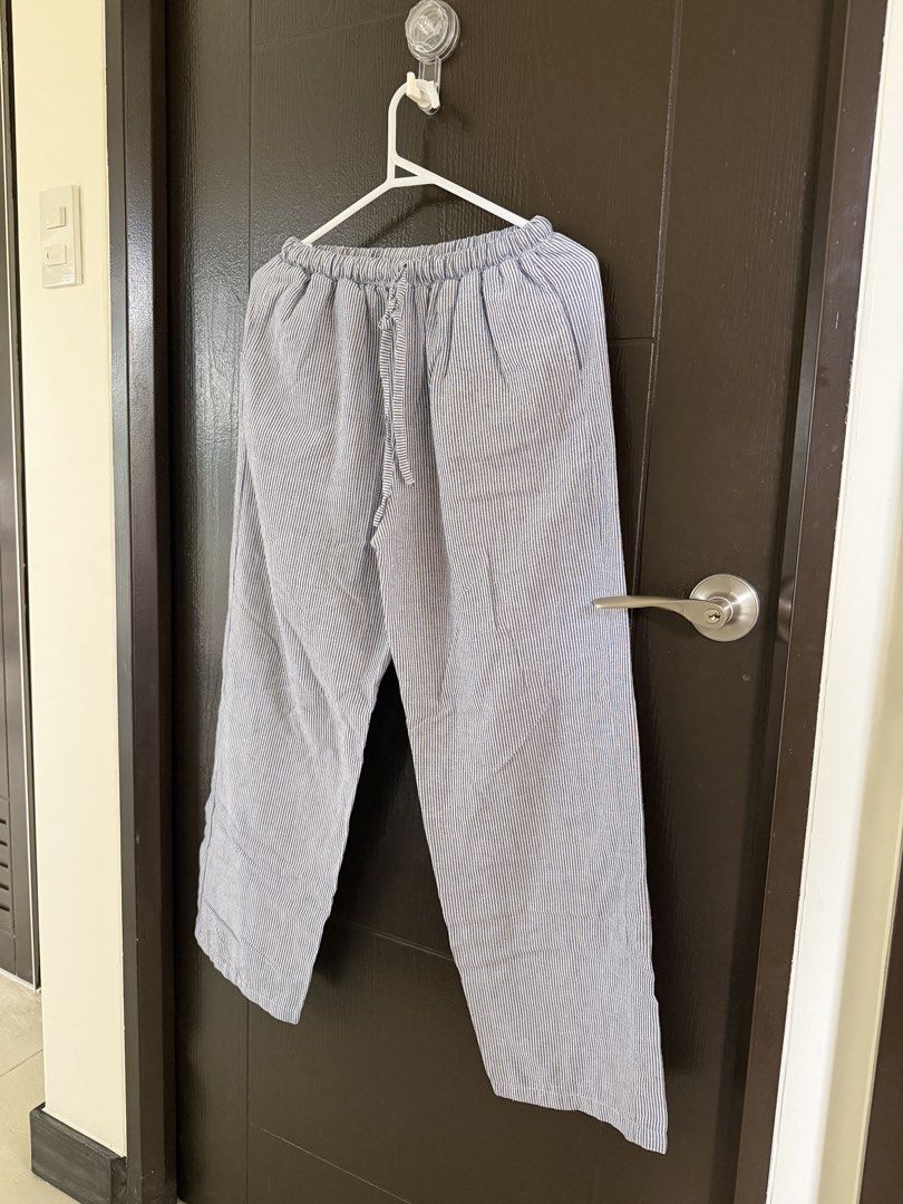 Striped Wide Leg Pants with Drawstring Waist (Category: Other Bottoms) located in Paranaque City. Submitted by shopnrepeat_ (Listing ID 1460819101, Image 2). Description: free size best fit 26"-28" length 37" - Light blue and white striped pattern - Wide leg cut for a relaxed fit - Comfortable elastic waistband with drawstring tie - Convenient side pockets - Versatile for lounging, errands, or casual wear - Easy to pair with any top.
