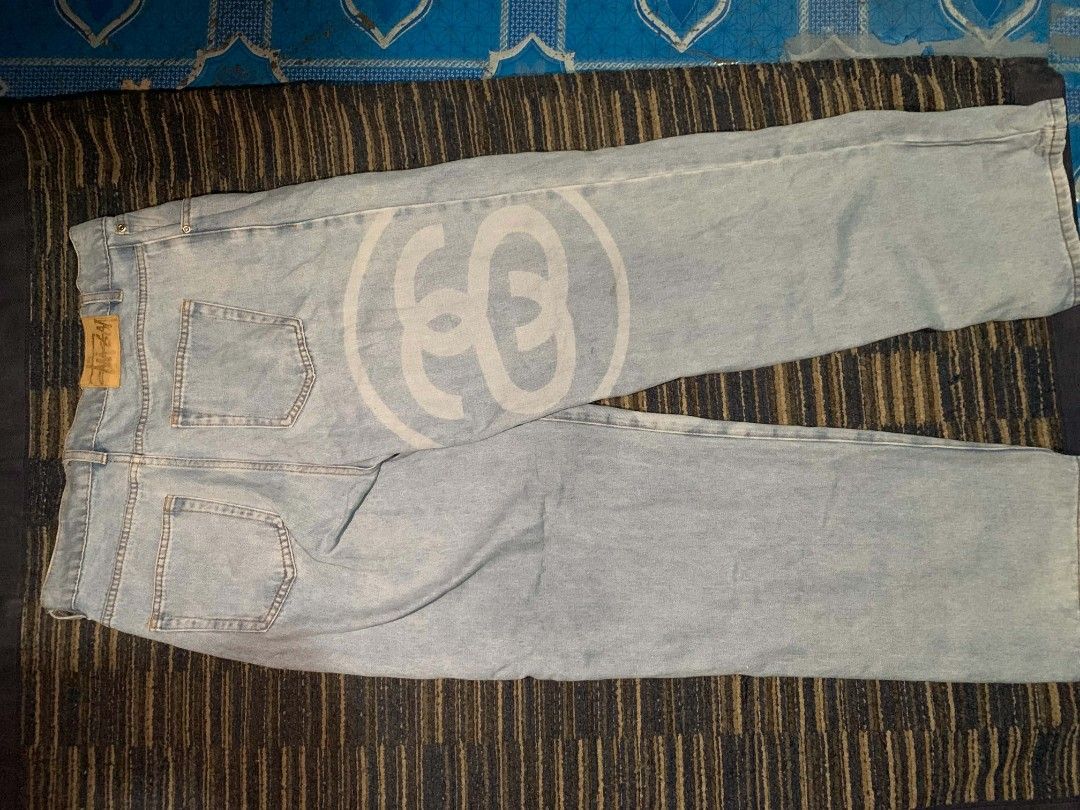 Stussy Light Wash Denim Jeans (Category: Jeans) located in Manila. Submitted by itsyourboymat (Listing ID 1460792461, Image 2). Description: - Light wash denim jeans - Iconic Stussy logo print on the leg - Button fly closure - Classic five-pocket styling - Relaxed fit - Ideal for casual wear.