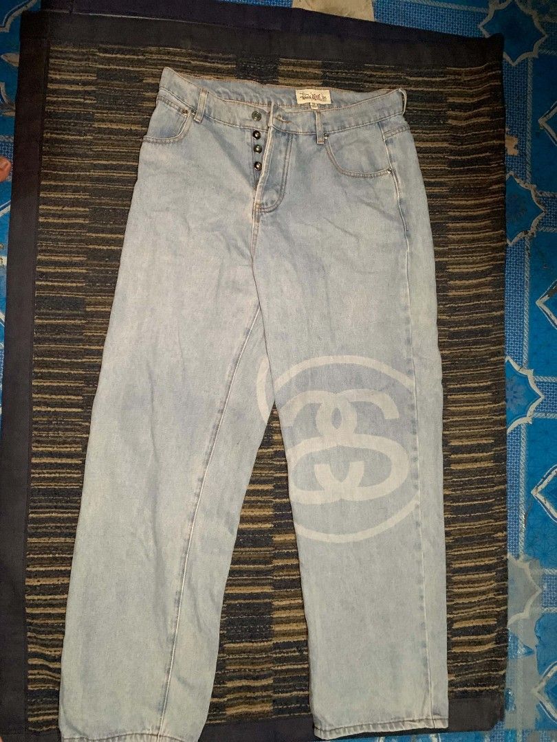Stussy Light Wash Denim Jeans (Category: Jeans) located in Manila. Submitted by itsyourboymat (Listing ID 1460792461, Image 1). Description: - Light wash denim jeans - Iconic Stussy logo print on the leg - Button fly closure - Classic five-pocket styling - Relaxed fit - Ideal for casual wear.