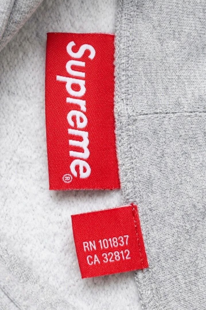 SUPREME HOODIE VEST (Category: Luxury Apparel) located in Manila. Submitted by swiftocean_2688ba (Listing ID 1460917458, Image 3). Description: Supreme Small Box Logo Zip-Up Hooded Vest in Heather Grey. Product Details Release: Archival piece from the iconic Fall/Winter 2014 collection. Design: Sleeveless fleece gilet construction featuring a full-zip front, drawstring hood, and classic split kangaroo pockets. Branding: Micro red Supreme box logo