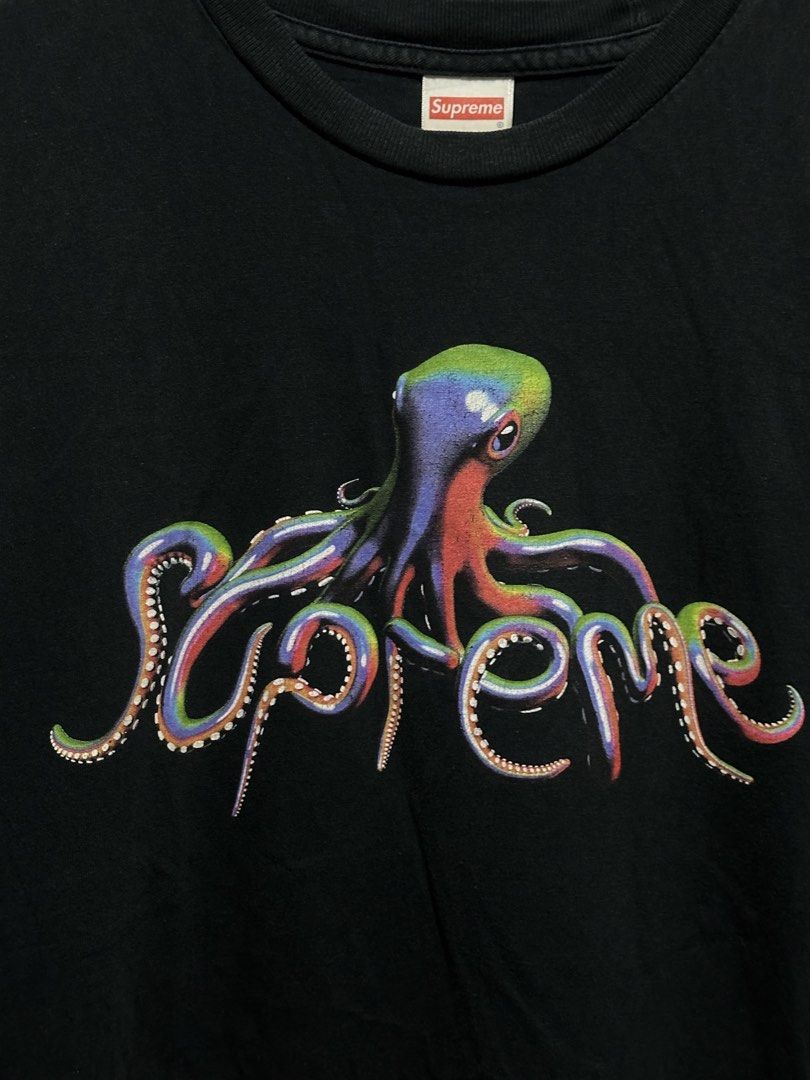 Supreme Tentacles Tee (SS18) (Category: Tshirts & Polo Shirts ) located in Buenavista. Submitted by themodernrack (Listing ID 1460805028, Image 2). Description: Brand: Supreme Color: Black Style: Graphic Tee (Features colorful octopus spellout print on chest) Tag Size: Medium (Fits True to Size) Condition: Good used condition (Light fading on fabric, slight hairline cracking on graphic print) Measurements (Inches): Width (Pit-to-Pit): 20” Length: