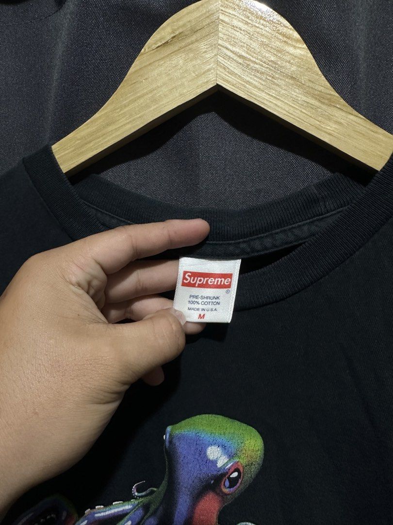 Supreme Tentacles Tee (SS18) (Category: Tshirts & Polo Shirts ) located in Buenavista. Submitted by themodernrack (Listing ID 1460805028, Image 3). Description: Brand: Supreme Color: Black Style: Graphic Tee (Features colorful octopus spellout print on chest) Tag Size: Medium (Fits True to Size) Condition: Good used condition (Light fading on fabric, slight hairline cracking on graphic print) Measurements (Inches): Width (Pit-to-Pit): 20” Length: