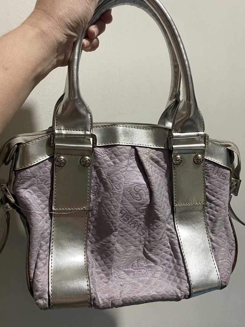 SWISH JEANS Silver Lilac Textured Handbag (Category: Shoulder Bags) located in Lucena. Submitted by mercie.banayo (Listing ID 1460865856, Image 2). Description: - Cute Swish Jeans handbag - Silver and lilac textured fabric - Metallic silver trim and handles - Zipper closure - Interior zip pocket and slip pockets - Metal studs on bottom for protection - Great for everyday use.
