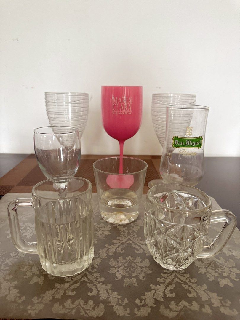 Take all Assorted Drinking Glasses and Mugs (Category: Other Kitchenware & Tableware) located in Manila. Submitted by dolcedeganda (Listing ID 1460795060, Image 1). Description: - Assorted collection of drinking glasses and mugs - Includes: 1 pink Maria Clara Sangria glass, 1 San Miguel beer glass - Also includes: 2 small glass mugs with handles, 3 clear glasses - Ideal for parties, gatherings, or everyday use - Features unique textures and desig