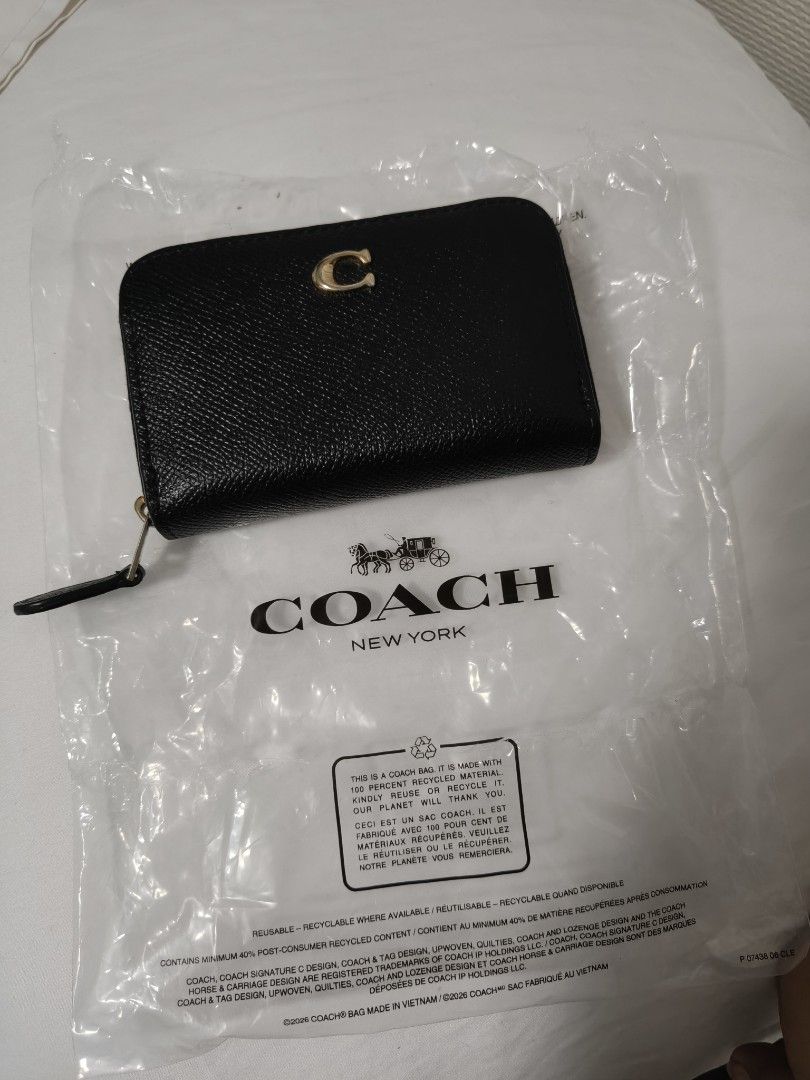 Take all for 1499 (Category: Wallets & Card holders) located in Tuguegarao City. Submitted by ghinzky_preloved (Listing ID 1460761763, Image 1). Description: Coach zip around wallet in black pebbled leather. Gold 'C' logo hardware. Interior has multiple card slots and a zip pocket. Comes in original packaging. Great for keeping essentials organized..