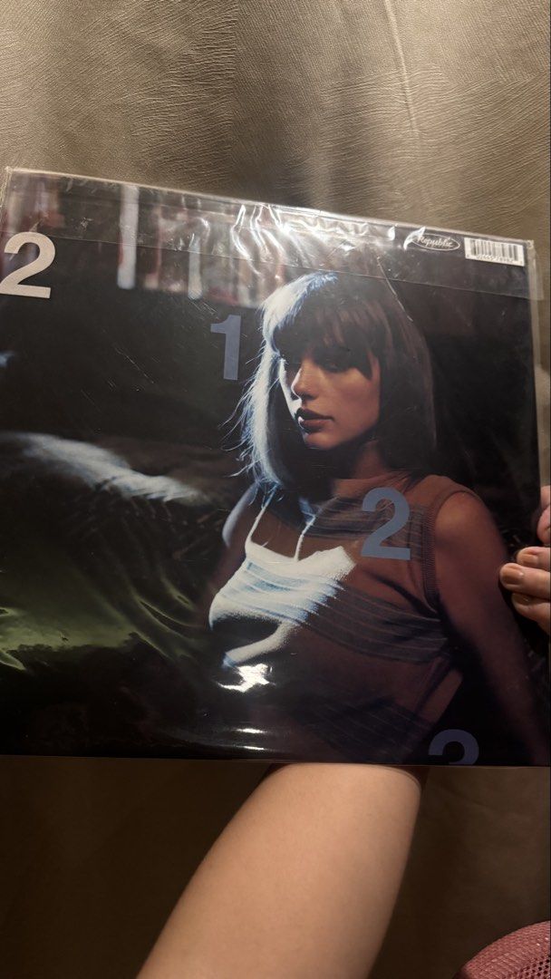 Taylor Swift Midnights Vinyl - Moonstone Blue Version (Category: Vinyls) located in Pasig City. Submitted by random_girl13 (Listing ID 1460917215, Image 2). Description: Taylor Swift Midnights Vinyl - Moonstone Blue Version Unsealed and changed plastic cover - never played and was stored. Small flaw on the upper side of cover (seen on photo) RFS: extra copy.