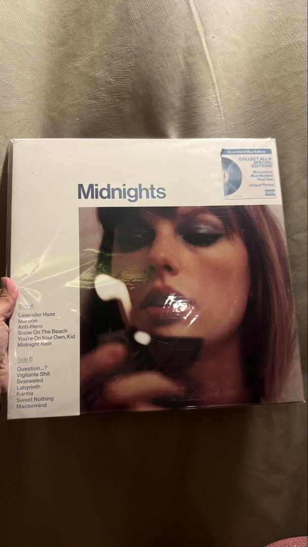 Taylor Swift Midnights Vinyl - Moonstone Blue Version (Category: Vinyls) located in Pasig City. Submitted by random_girl13 (Listing ID 1460917215, Image 1). Description: Taylor Swift Midnights Vinyl - Moonstone Blue Version Unsealed and changed plastic cover - never played and was stored. Small flaw on the upper side of cover (seen on photo) RFS: extra copy.