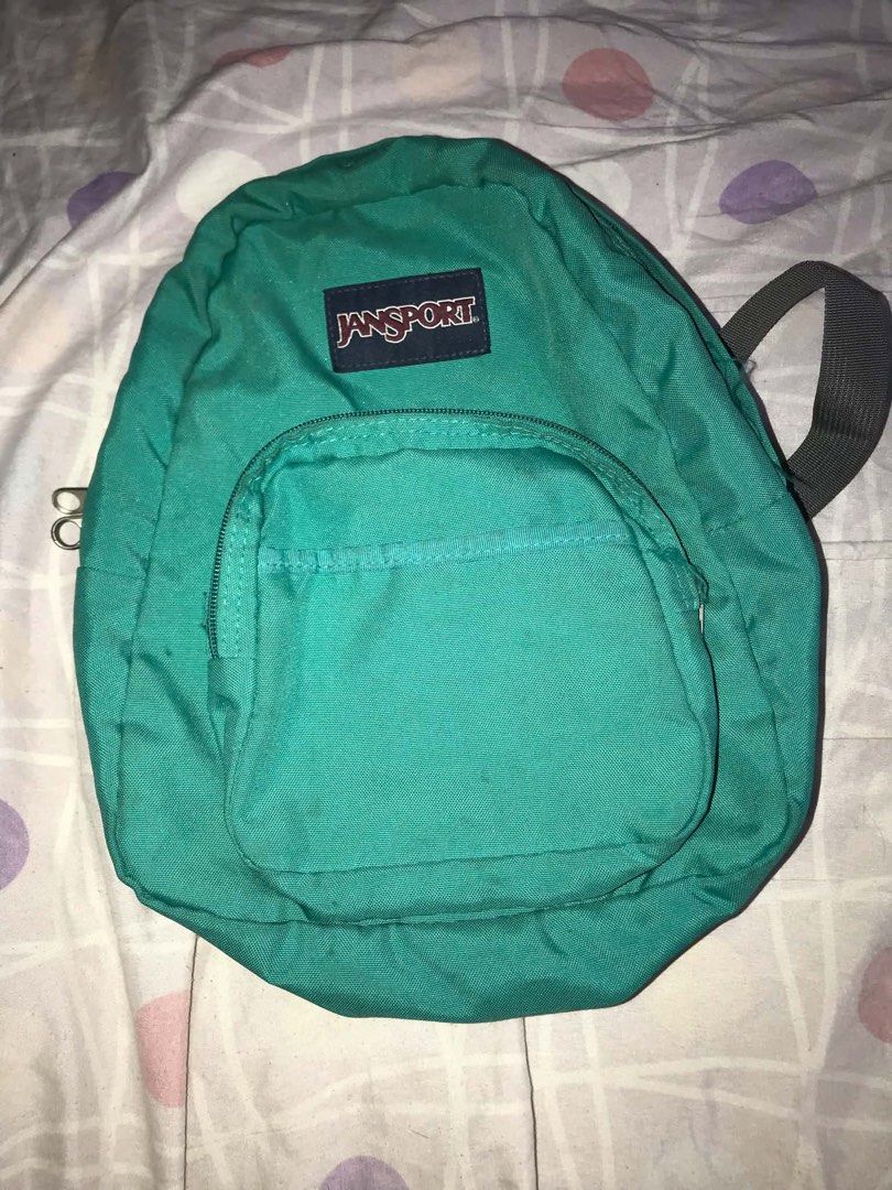 Teal Jansport Half Pint Mini Backpack (Category: Backpacks) located in Antipolo. Submitted by noellemags (Listing ID 1460899973, Image 1). Description: - JanSport Green Half Pint Mini Backpack - Features a front pocket - Adjustable straps for comfort - Small stain on the back (visible in the last photo) - Ideal for everyday use or travel.