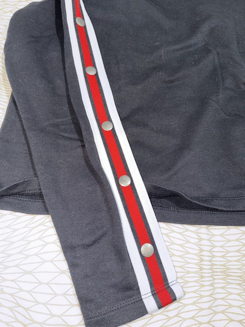 Terranova Black Long Sleeve Top with Snap Button Sleeves (Category: Longsleeves) located in Mandaluyong City. Submitted by kqloset (Listing ID 1460820074, Image 3). Description: - Brand: Terranova - Color: Black - Style: Long-sleeved top - Details: Red and white stripe detail on sleeves, snap buttons on sleeves - Occasion: Casual, everyday wear - Features: Stylish and comfortable.