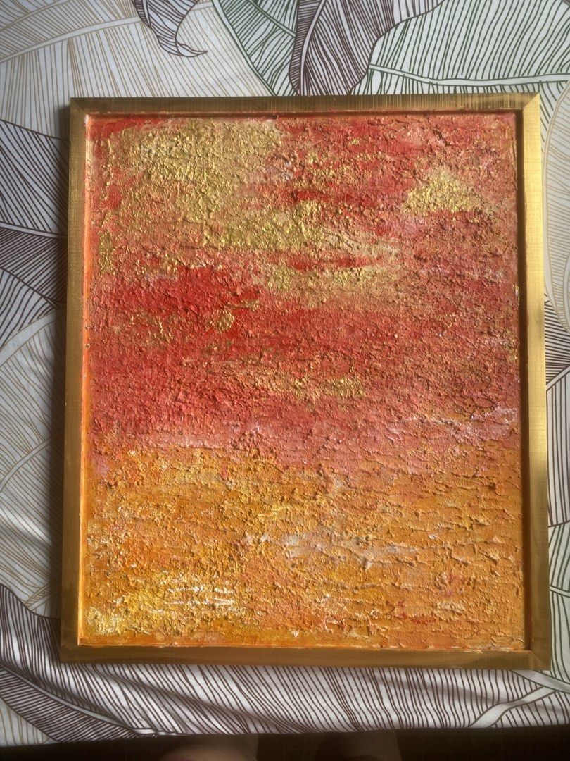 Textured Sunset Painting with Gold Frame (Category: Frames & Pictures) located in Pasay City. Submitted by michelleip24 (Listing ID 1460723679, Image 1). Description: - Textured sunset painting with a rich color palette (deep red, orange, bright yellow, gold). - Pronounced texture for a unique tactile and visual appeal. - Comes with a simple, elegant gold-colored frame. - Ideal for enhancing any room with a vibrant splash of color..