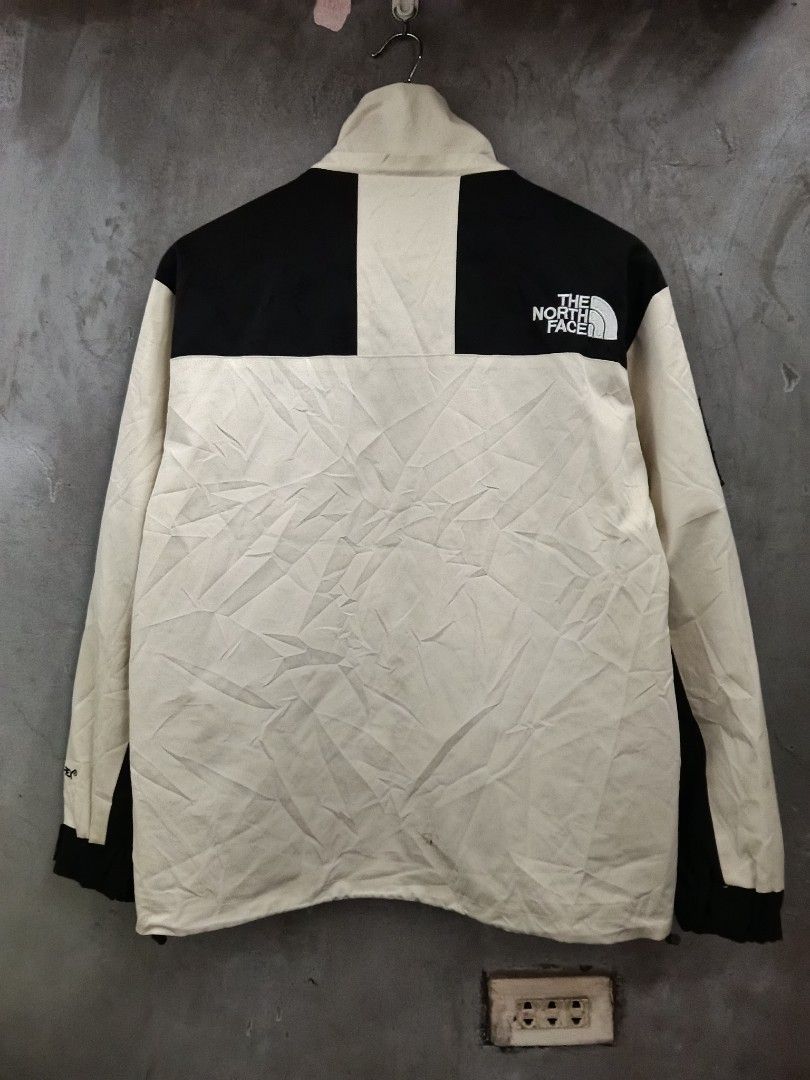 The North Face Jacket Beige Black Size M (Category: Coats, Jackets and Outerwear) located in Caloocan City. Submitted by arielagost83627 (Listing ID 1460800272, Image 2). Description: - Brand: The North Face - Color: Beige and Black - Size: Medium (M) - Features: Classic North Face logo on chest, back, and left sleeve patch - Design: Button-up front with a high collar - Ideal for: Outdoor activities and casual wear Color Rate: 9.5/10 Dimes: 22x26