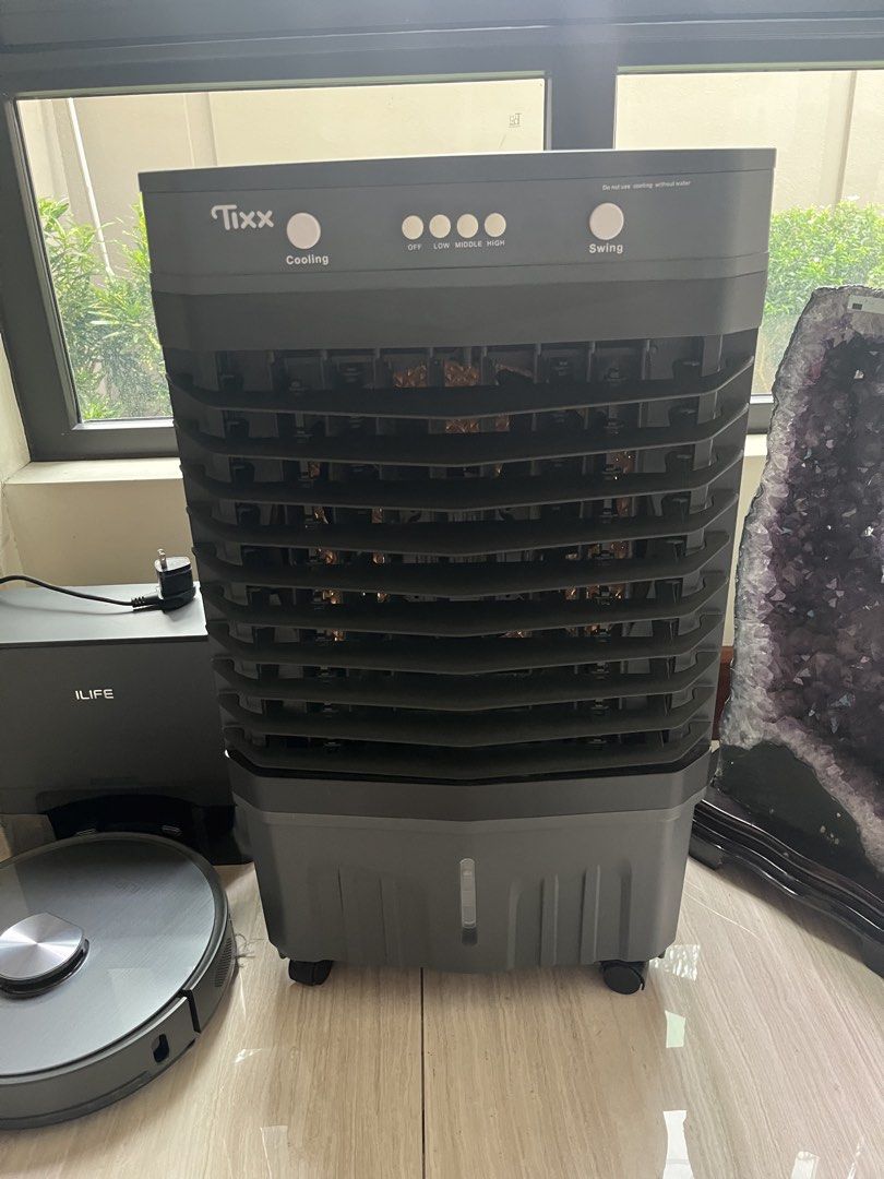 Tixx Air Cooler Fan with Cooling and Swing Function 50L (Category: Air Conditioning and Heating) located in Quezon City. Submitted by ryaneunice76603 (Listing ID 1460725953, Image 1). Description: - Tixx Air Cooler for effective room cooling - Cooling and Swing functions included - Multiple speed settings: Off, Low, Middle, High - Convenient water tank located at the bottom - Proven to work well and keep your room cool - 50L water tank capacity .
