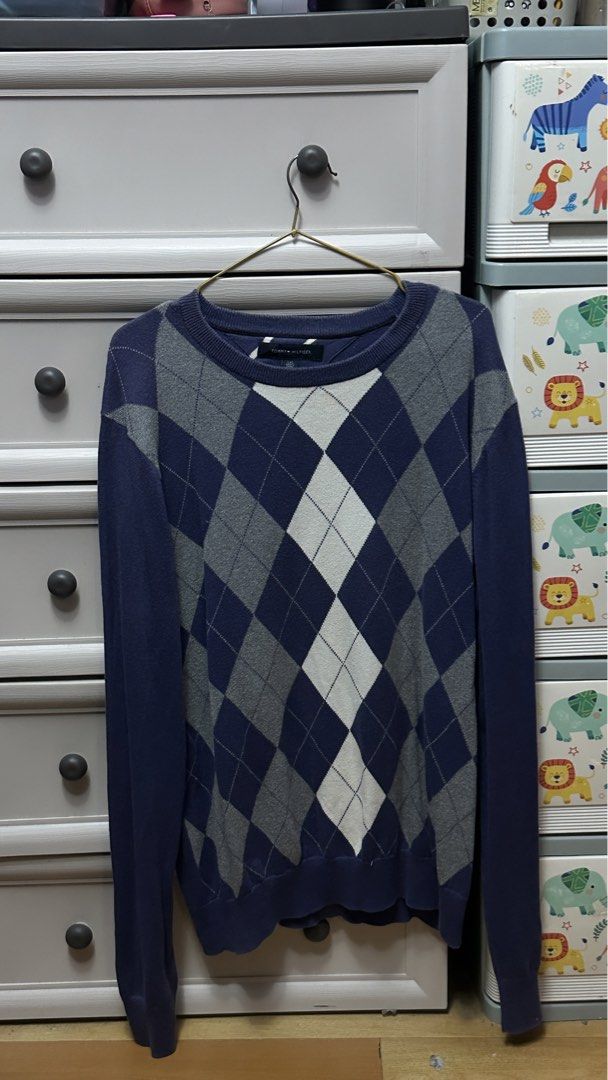 Tommy Hilfiger Argyle Sweater - Size L (Category: Coats, Jackets and Outerwear) located in Antipolo. Submitted by Jhedqt. (Listing ID 1460871524, Image 1). Description: - Classic Tommy Hilfiger argyle sweater - Navy blue with grey and white diamond pattern - Crew neck, long sleeves - Size L - Perfect for layering or wearing solo - Comfortable and stylish M-L.
