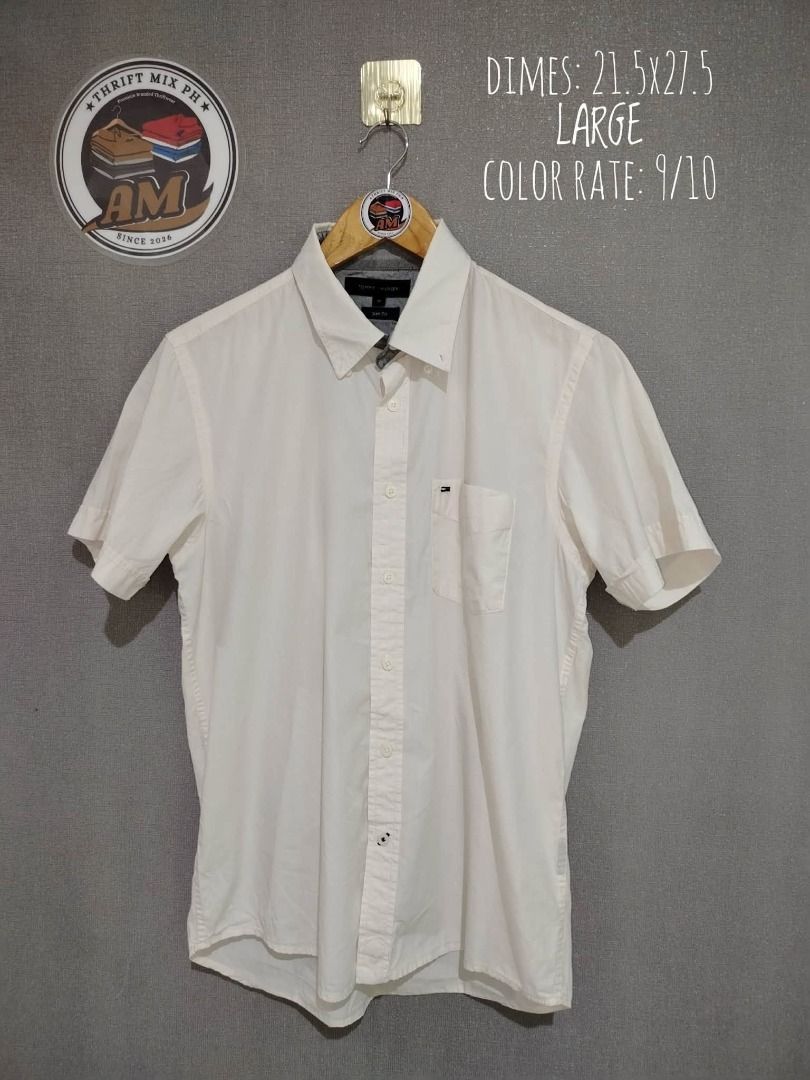 Tommy Hilfiger Buttondown (Category: Tshirts & Polo Shirts ) located in Dasmarinas. Submitted by amthriftmixph.2001 (Listing ID 1460736492, Image 1). Description: BRAND: Tommy Hilfiger SIZE: Large DIMES: 21.5" Width x 27.5" Length CONDITION: 9/10 COLOR RATE: 9/10 TAGS: With Brand Tags ISSUE: Cut wash tag.