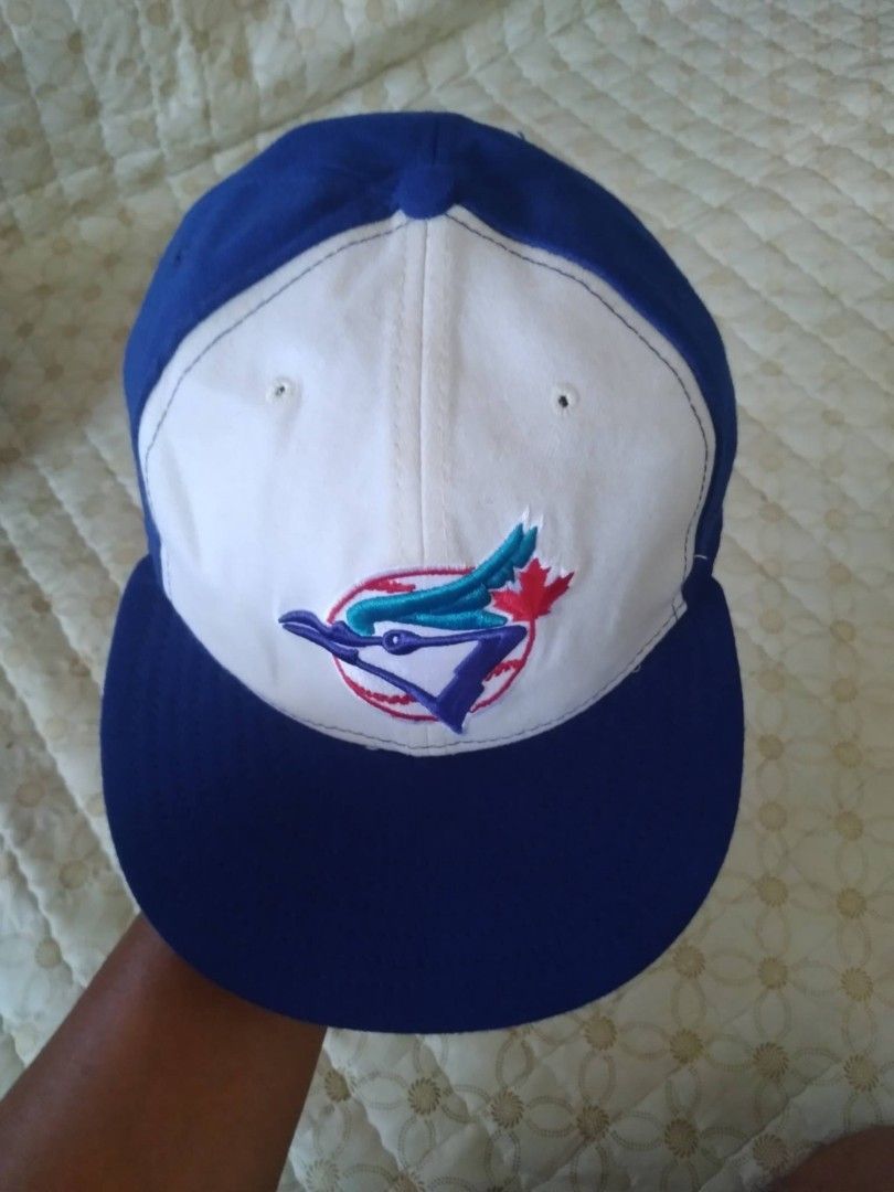 Toronto Blue Jays Baseball Cap Size 7 ⁵/⁸ (Category: Caps & Hats) located in Zamboanga. Submitted by nurbya898048 (Listing ID 1460918608, Image 3). Description: Classic Toronto Blue Jays baseball cap. Features the iconic Blue Jays logo on the front. White crown with royal blue brim and details. Great for any fan. Show your team spirit. Tag size 7 ⁵/⁸ 60.6 cm Excellent condition Color rate 9.8/10 Presentable,no flaws Check all photos for details 7