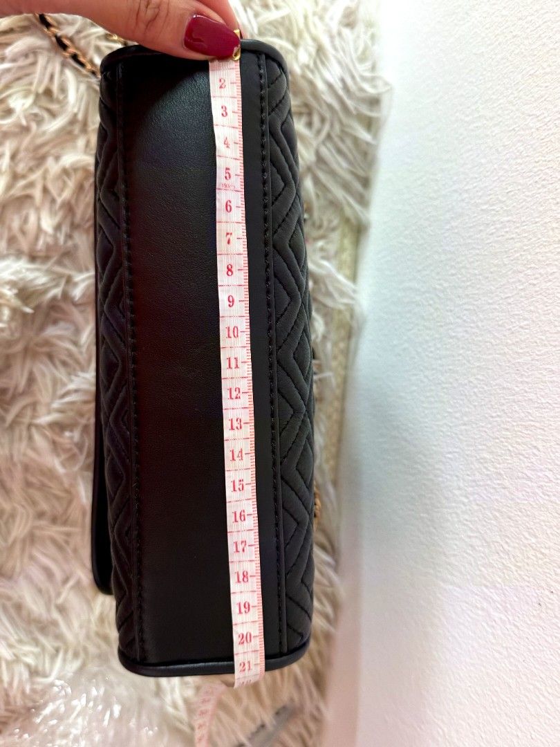 Tory Burch Black Quilted Leather Chain Shoulder Bag (Category: Luxury Bags & Wallets) located in Caloocan City. Submitted by mylove326 (Listing ID 1460801019, Image 3). Description: -Original Tory Burch Fleming -Black quilted leather shoulder bag - Signature Tory Burch logo - Gold chain strap - Tassel detail - Measurements: L 20cm x H 14cm x W 6cm - Versatile for day or night use -Can use as shoulder bag or body bag.. -Good as New -Used once or t
